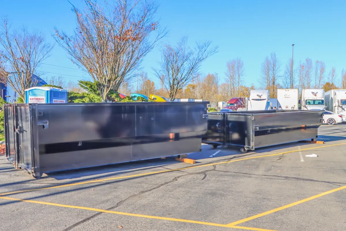 Professional dumpster rental service with roll-off container on residential driveway in Sebring
